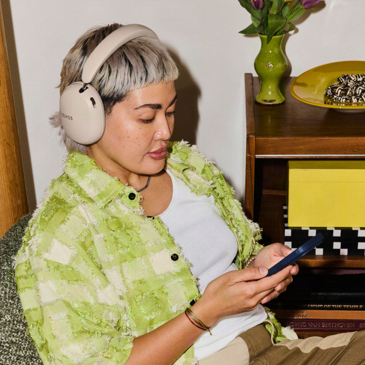 Listening to Sonos Ace Ultra in a plant-filled living room